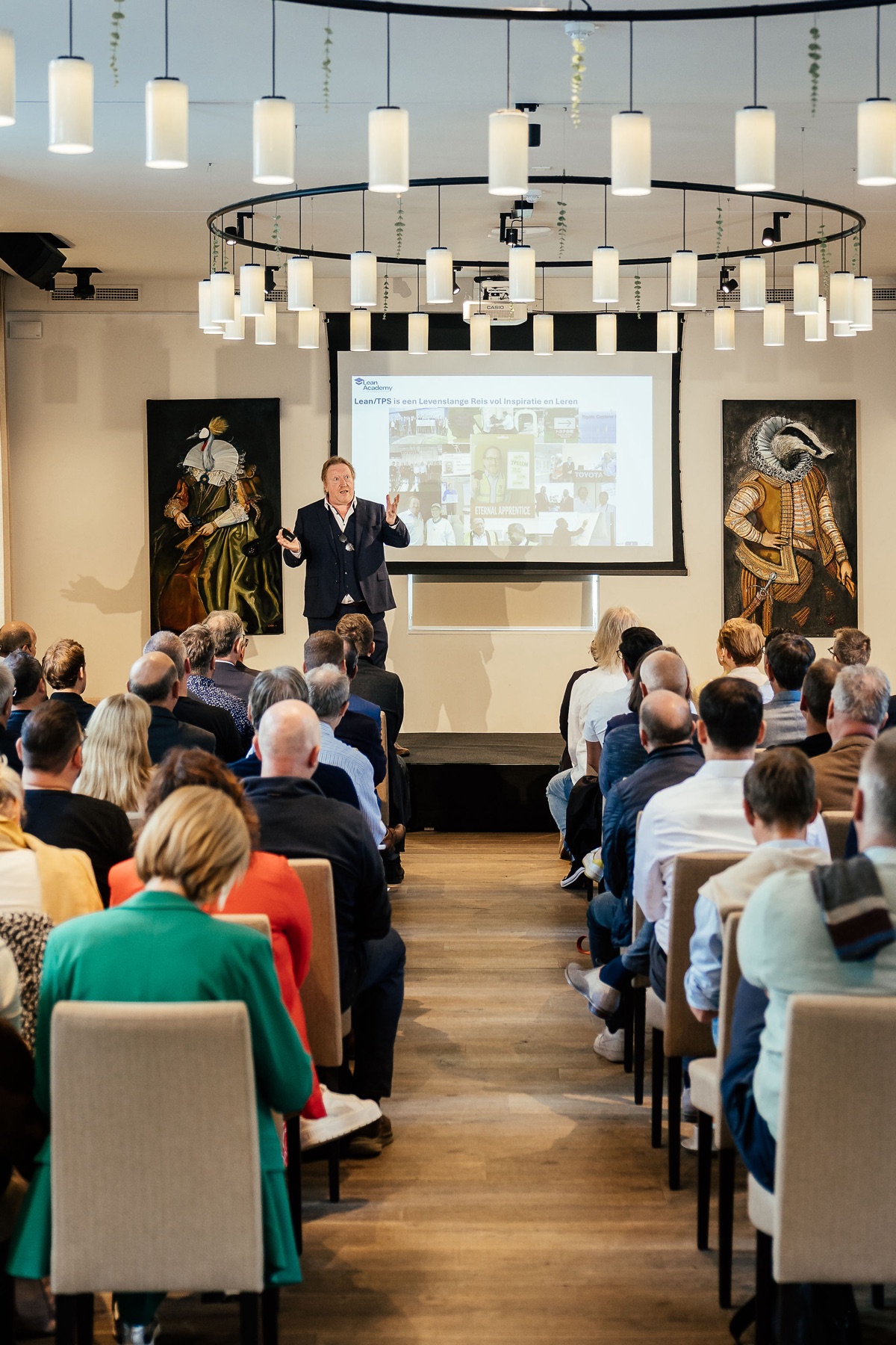 Participants listening to Dirk Van Goubergen at the Lean Academy symposium